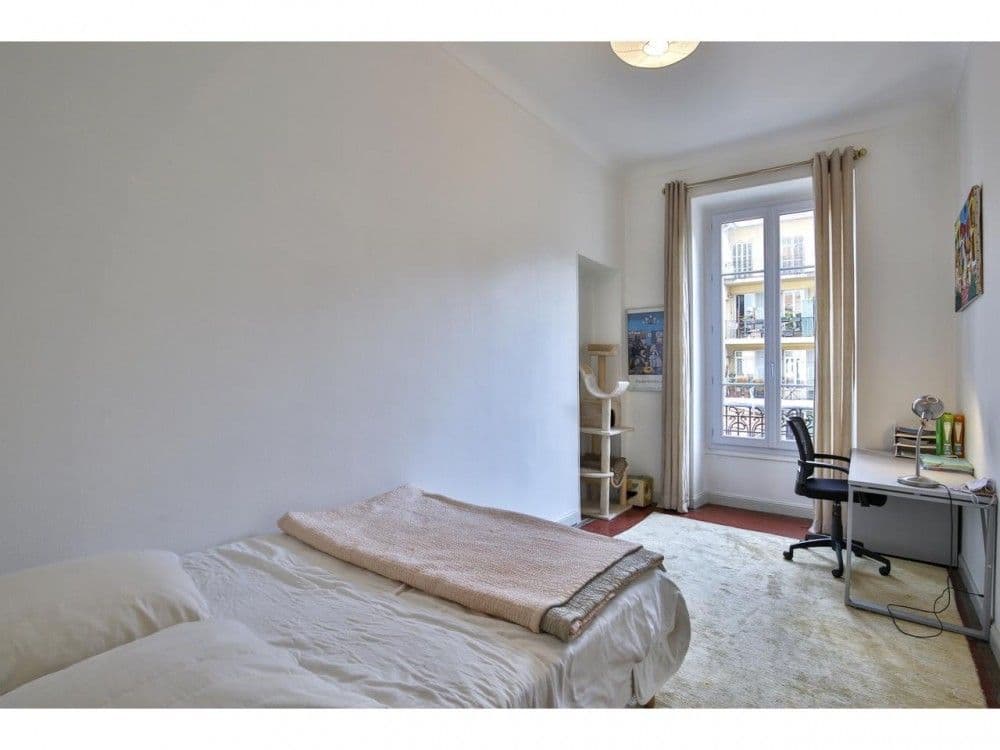 Bedroom with desk and tall window, 2-bedroom apartment in the Port, Nice