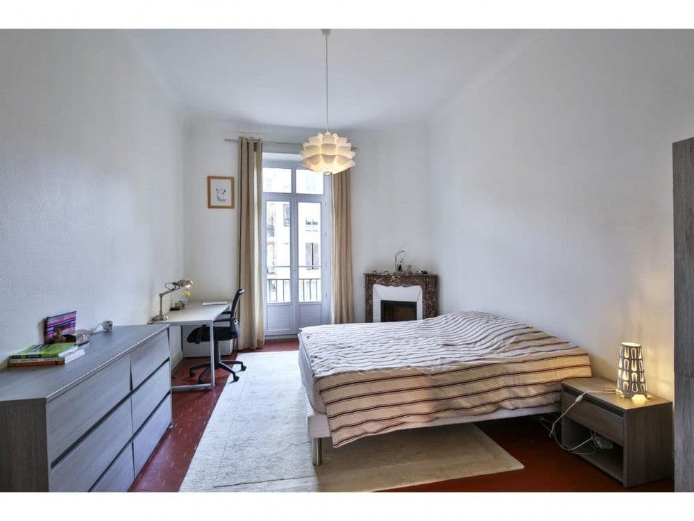 Bedroom with marble fireplace and French window, 2-bedroom apartment in the Port, Nice