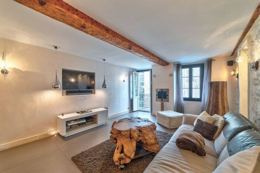Living room with sofa and exposed beam, 1-bedroom apartment in the Port, Nice