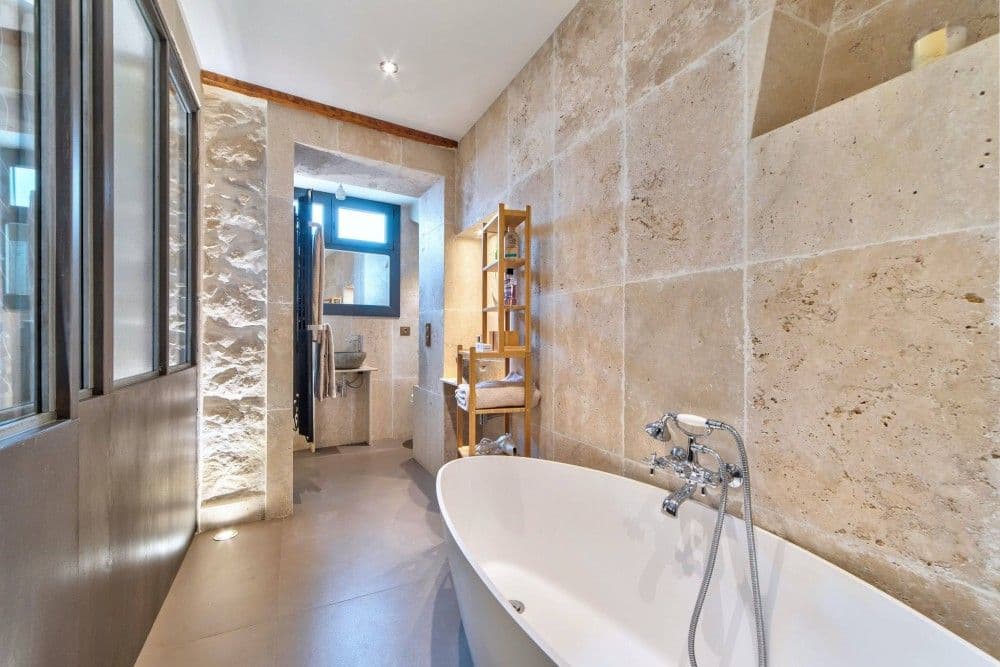 Travertine bathroom with freestanding bathtub, 1-bedroom apartment in the Port, Nice