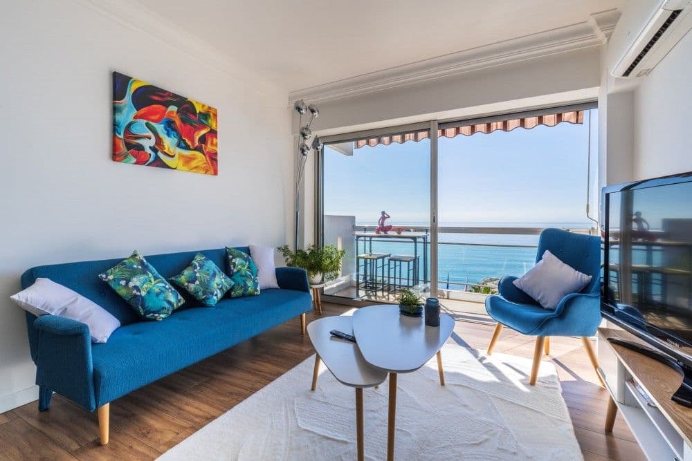Living room with sea view through floor-to-ceiling windows, 2-bedroom apartment in Cagnes-sur-Mer