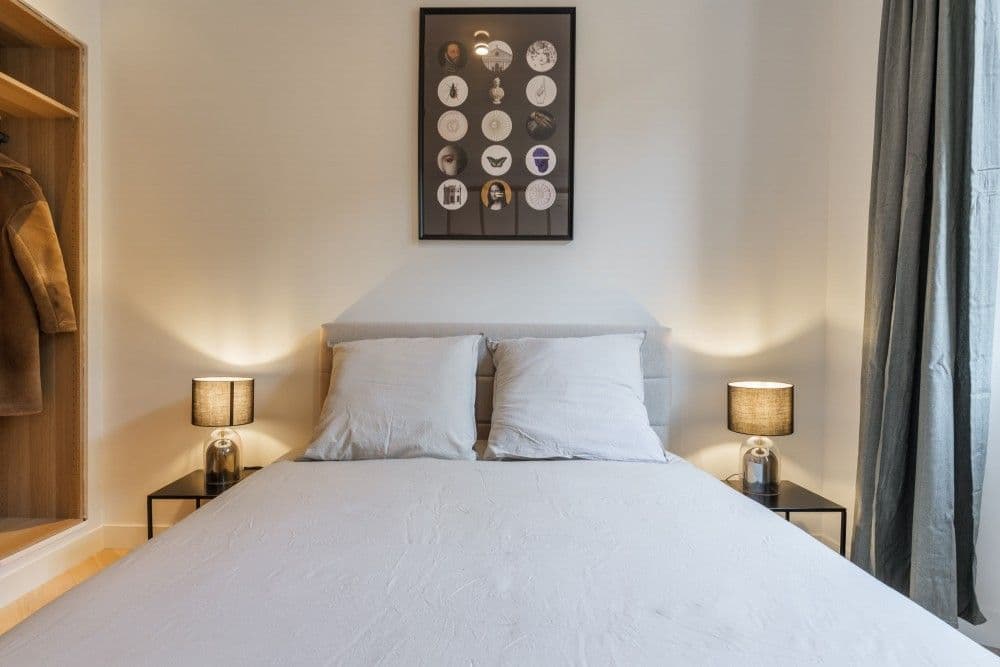 Bedroom with upholstered headboard and framed print, 2-bedroom apartment in the Old Town, Nice