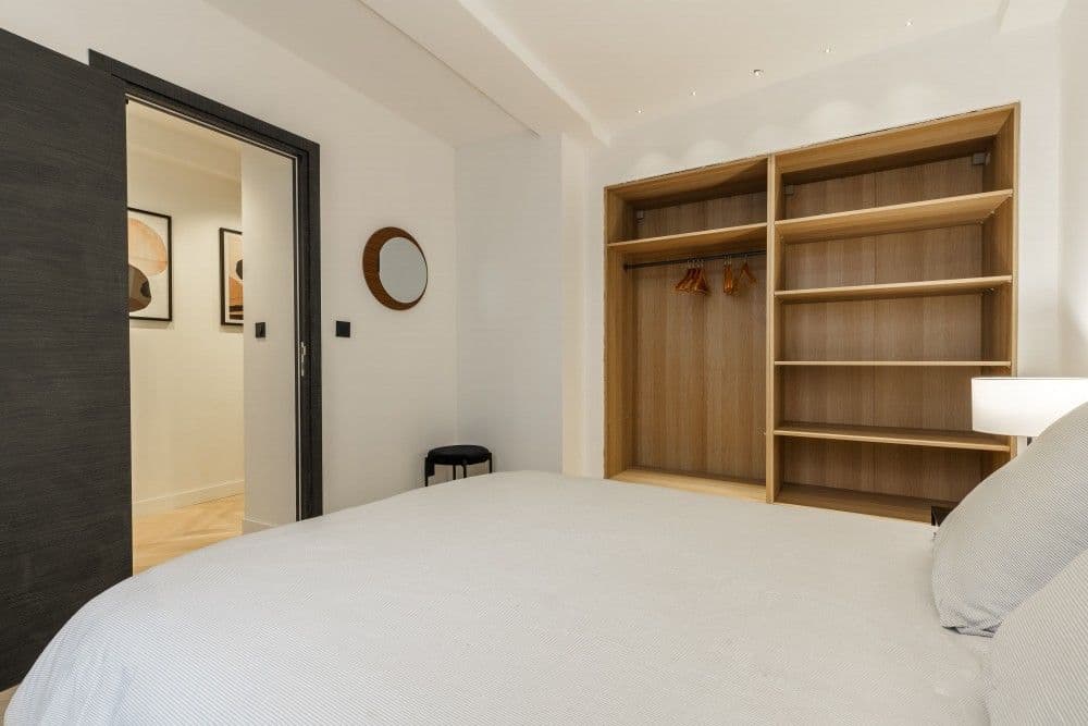 Bedroom with built-in wardrobe and doorway, 2-bedroom apartment in the Old Town, Nice