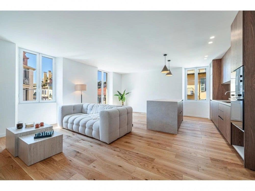 Renovated living room with oak floor and open kitchen, 2-bedroom apartment in the Port, Nice