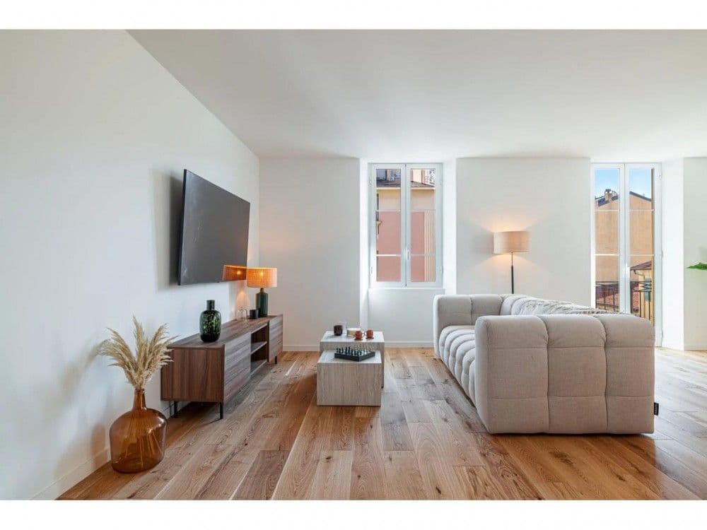 Living room with sofa and tall windows, 2-bedroom apartment in the Port, Nice