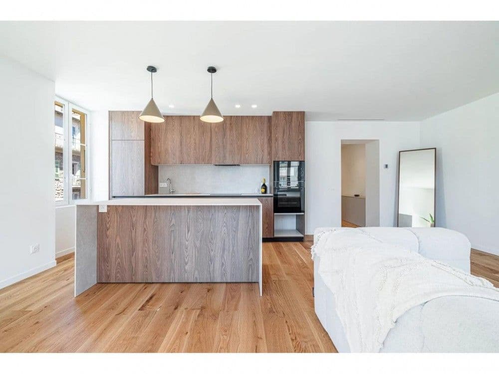 Living room with kitchen island and walnut cabinetry, 2-bedroom apartment in the Port, Nice
