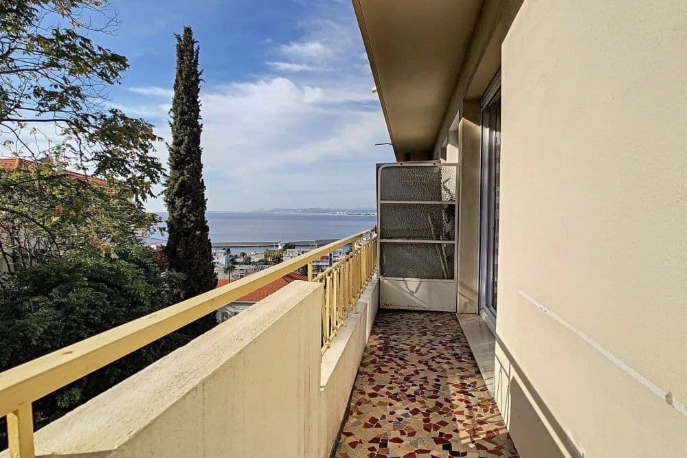 Long balcony with a view through cypress trees to the sea, 1-bedroom apartment in Mont Boron, Nice