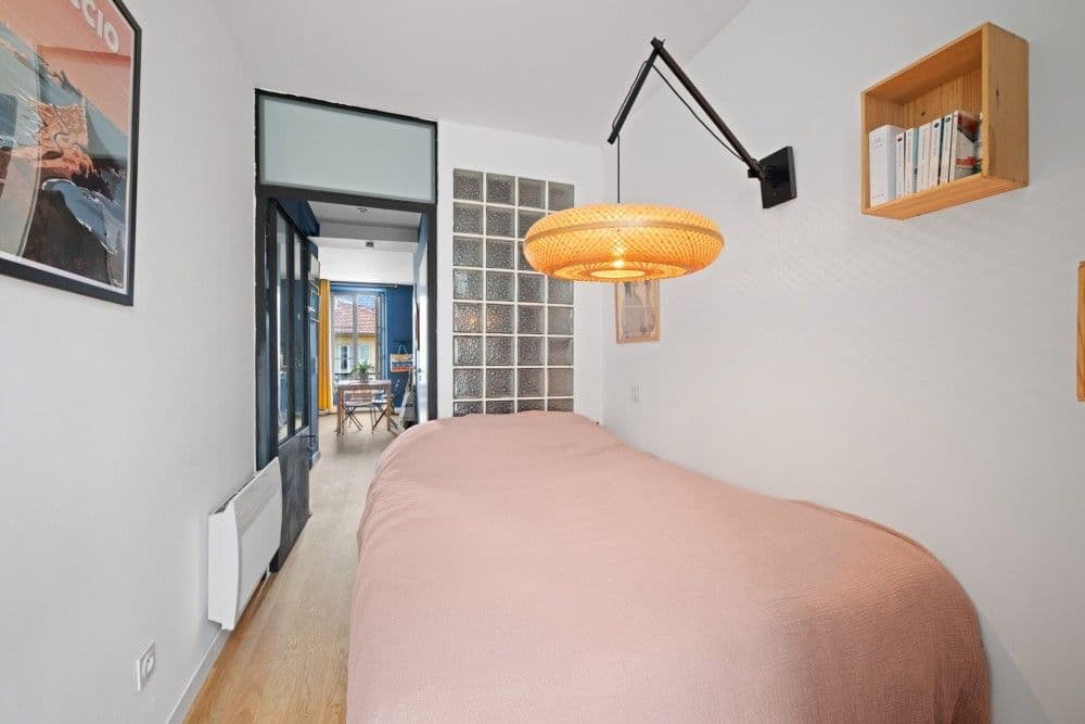 Bedroom with view through to the living room, 1-bedroom apartment in the Port, Nice