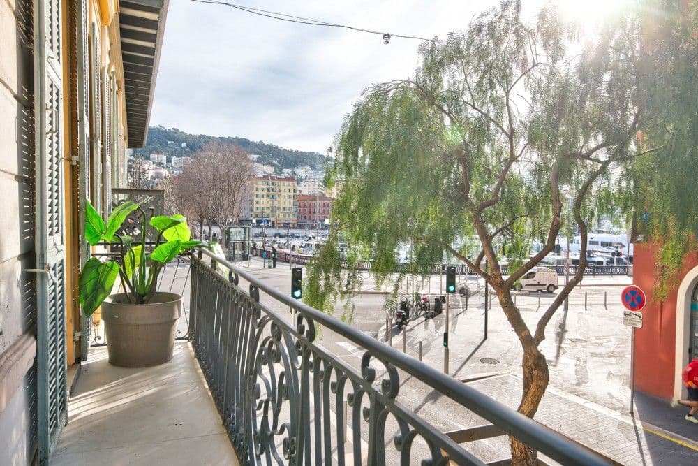 Balcony with wrought-iron railing overlooking the Port and the hills, 2-bedroom apartment in the Port, Nice