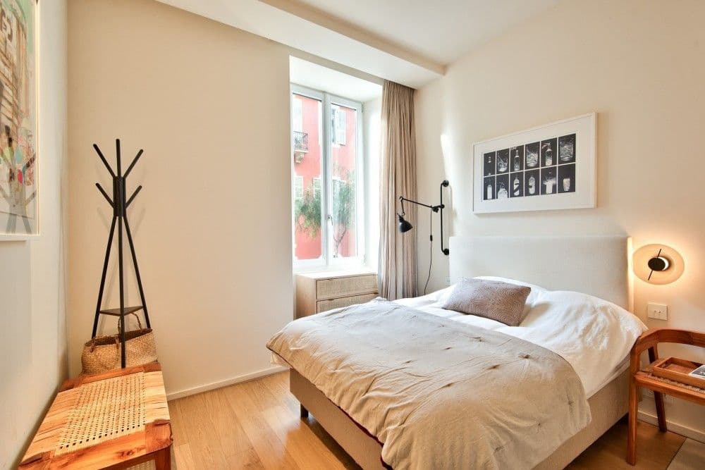 Bedroom with French window and bedside lights, 2-bedroom apartment in the Port, Nice