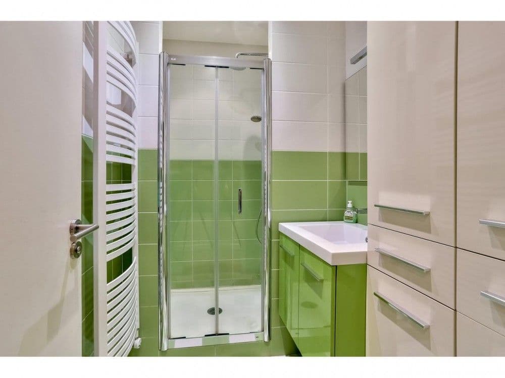 Shower room with green tiling, walk-in shower and heated towel rail, 2-bedroom apartment in the Port, Nice