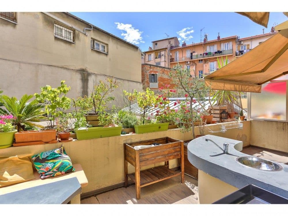 Terrace with an outdoor kitchen counter, planters and rooftop views, 2-bedroom apartment in the Port, Nice