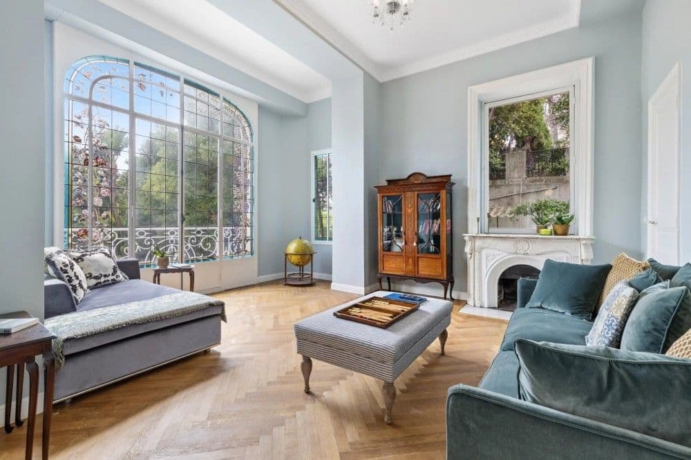 Living room with an arched picture window and fireplace, 4-bedroom villa in Mont Boron, Nice