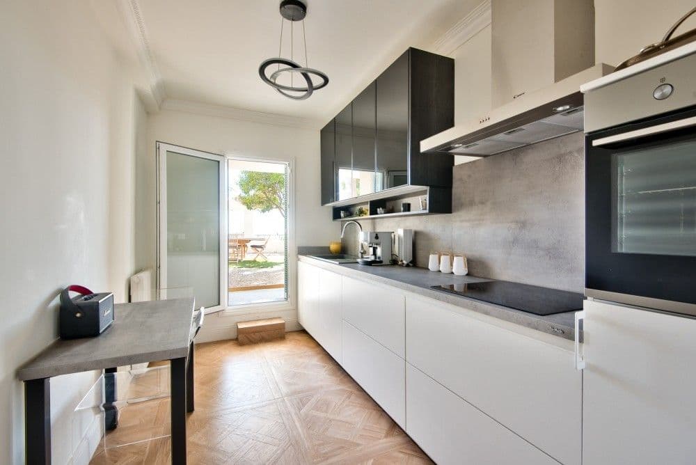 Kitchen with white units and door to the garden, 4-bedroom villa in Mont Boron, Nice