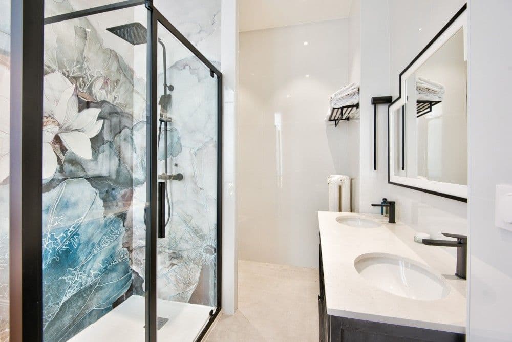 Shower room with floral tiles and black-framed enclosure, 4-bedroom villa in Mont Boron, Nice