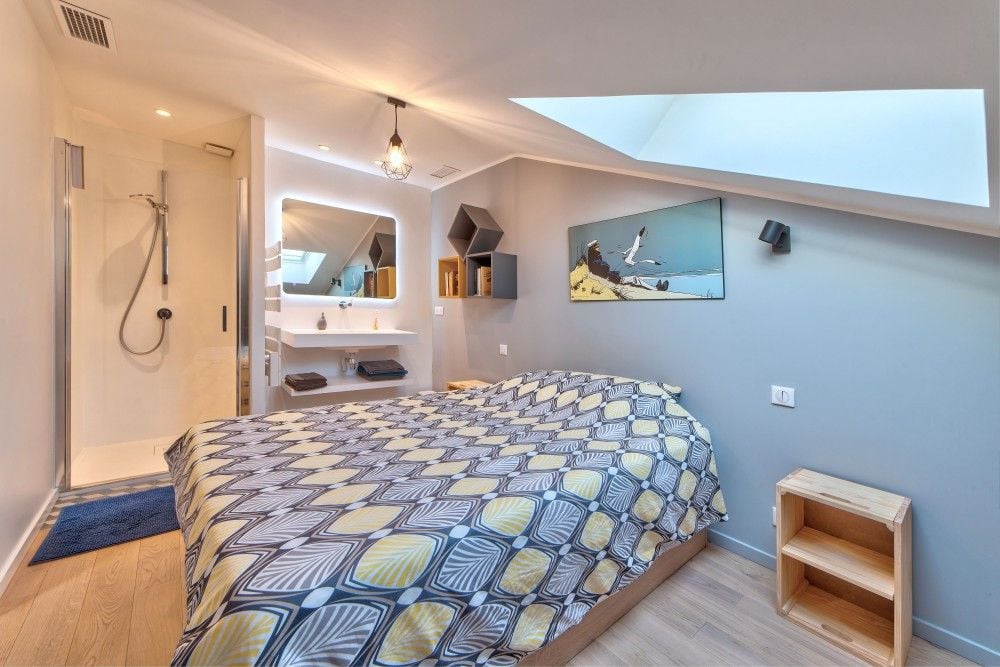 Bedroom under a skylight with en-suite shower, 2-bedroom apartment in the Port, Nice