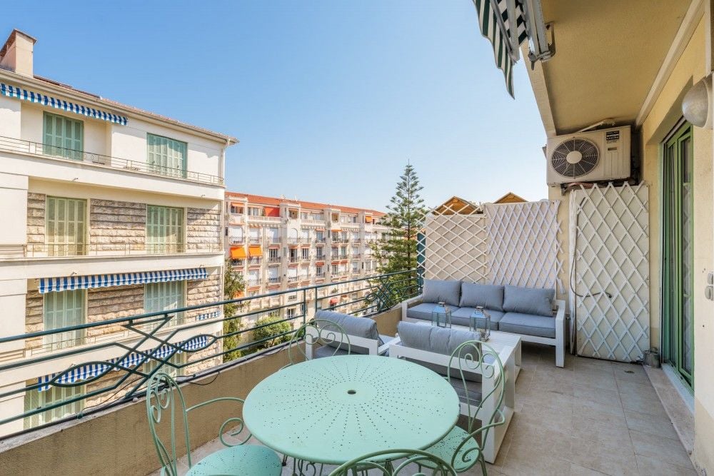 Balcony with seating and a view over the rooftops, 1-bedroom apartment in central Nice