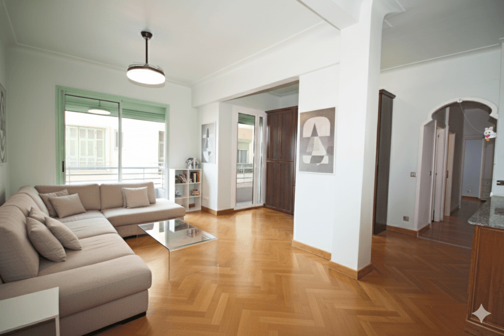 Living room with corner sofa and herringbone parquet, 2-bedroom apartment in the Promenade des Anglais, Nice