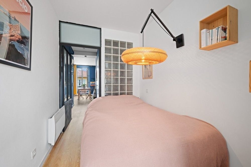 Bedroom with view through to the living room, 1-bedroom apartment in the Port, Nice
