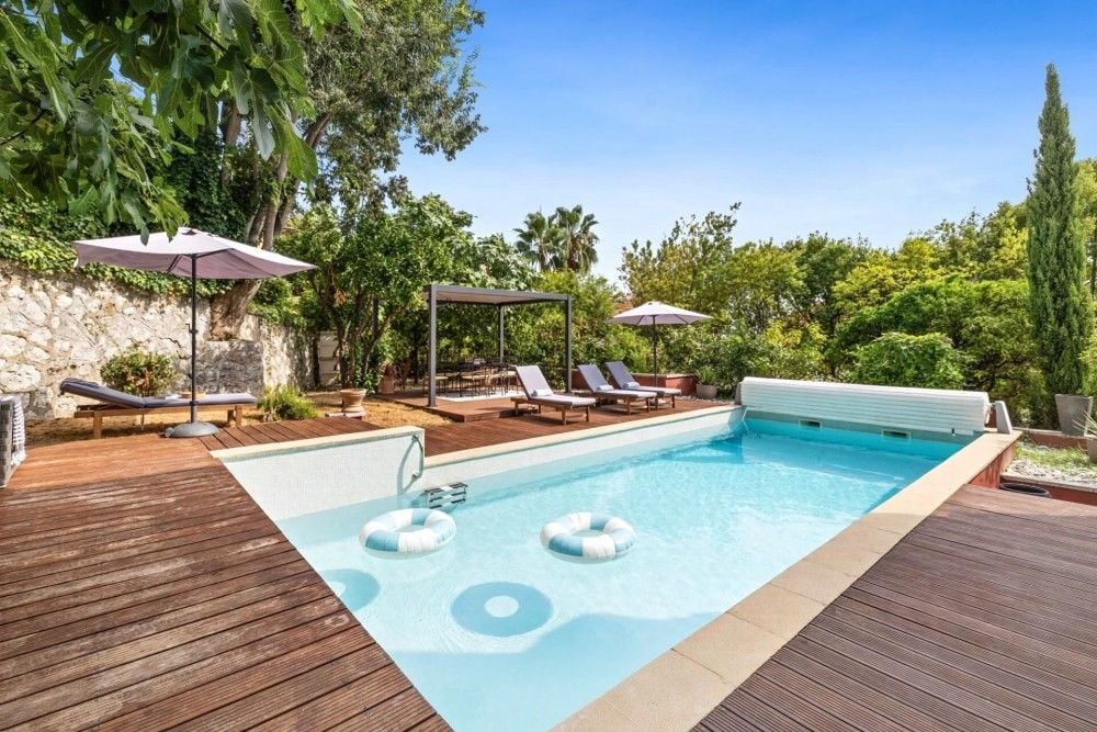 Swimming pool on a wooden deck surrounded by gardens, 4-bedroom villa in Mont Boron, Nice