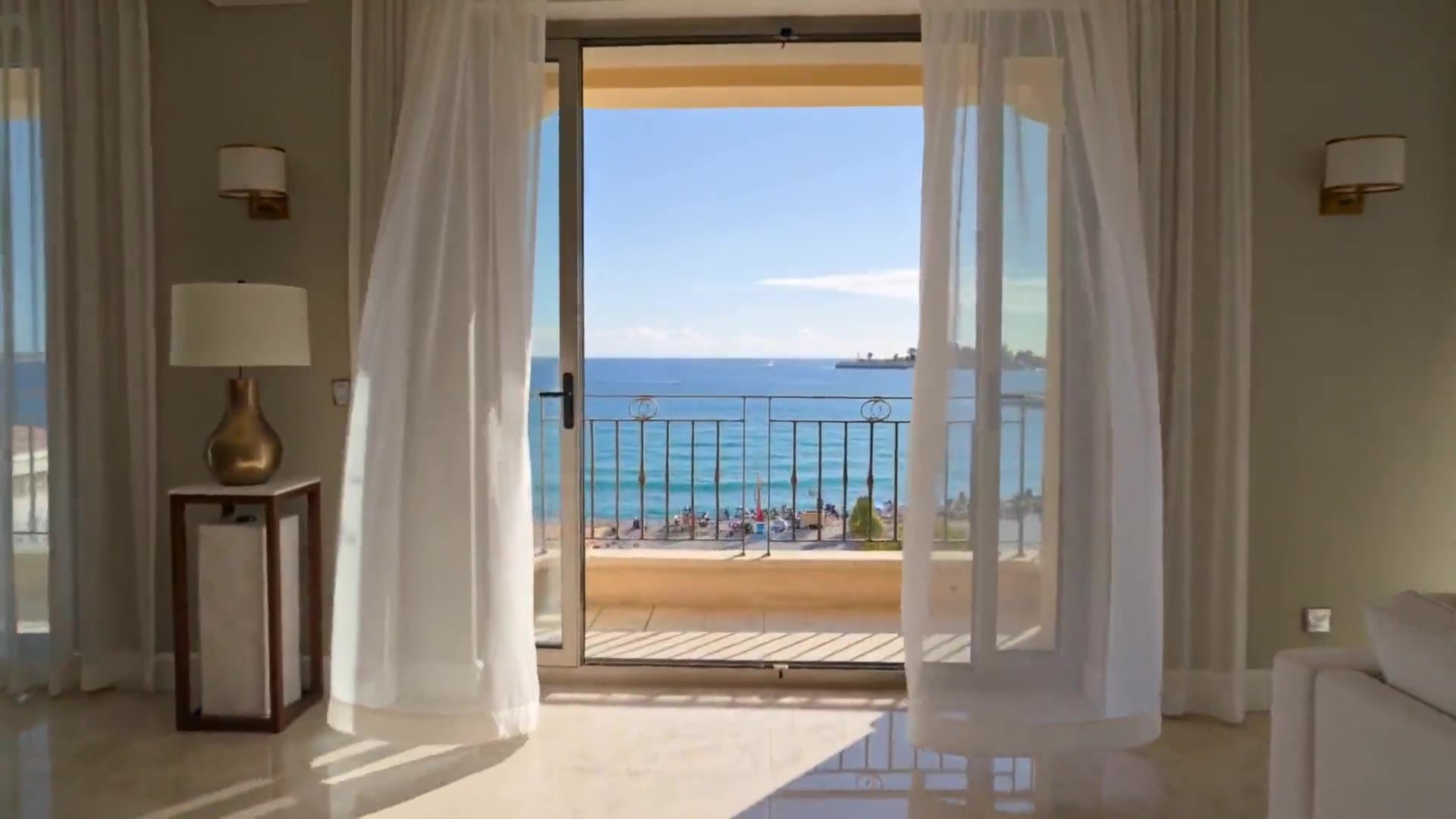 Sea-view apartment in Nice, the curtains open onto the terrace
