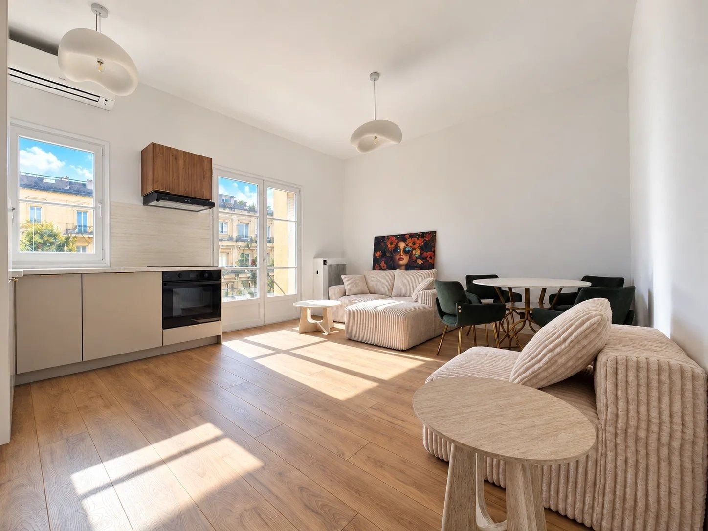 Bright open-plan living room with a kitchen, sofa and dining table, 1-bedroom apartment in Nice centre, Nice