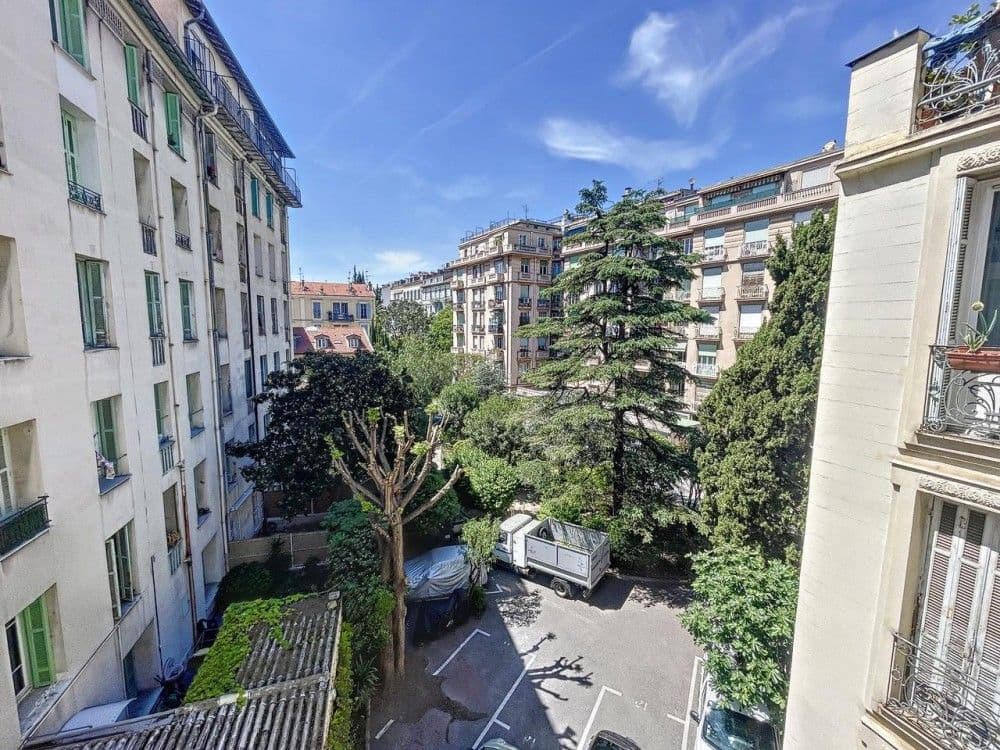 View from the balcony over gardens and neighbouring buildings, 2-bedroom apartment in the Carré d’Or, Nice