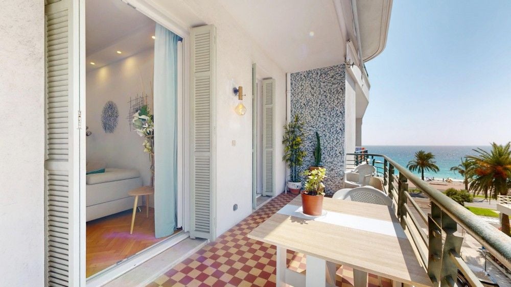 Balcony with red tiled floor and a view of the sea, 1-bedroom apartment in the Promenade des Anglais, Nice
