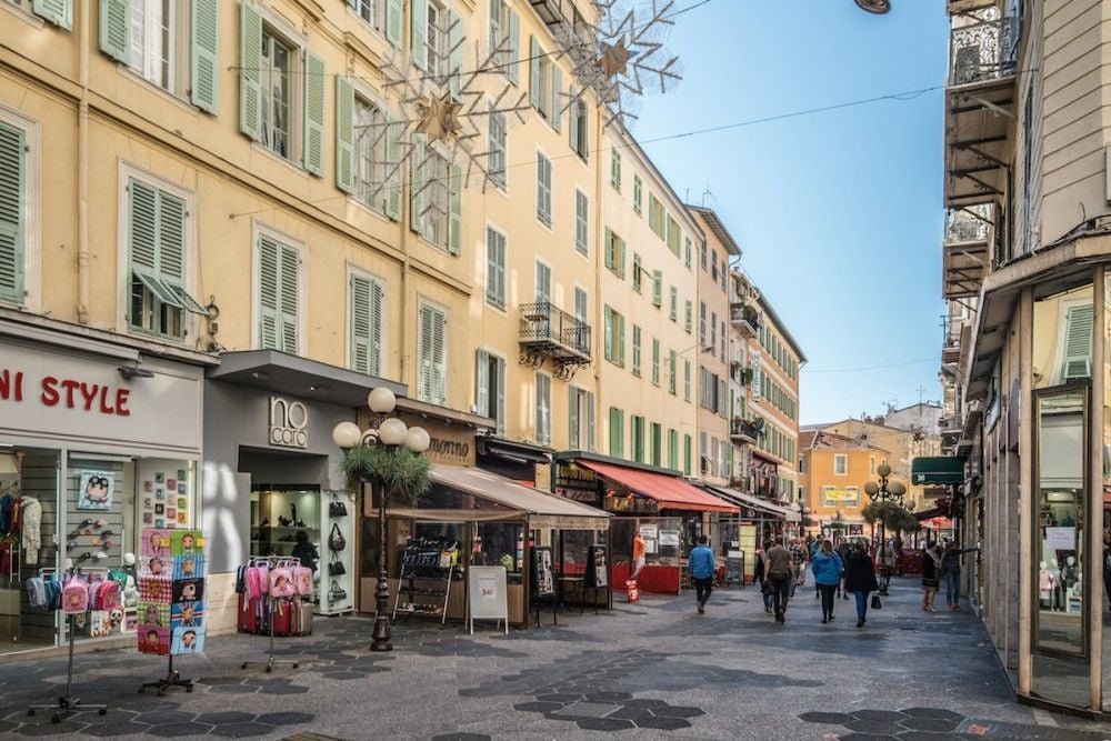 A pedestrian street of shops and cafés in the centre of Nice