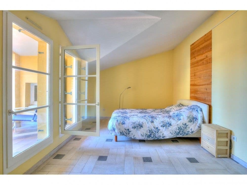 Bedroom with sloping ceiling and French window to the terrace, 2-bedroom apartment in the Old Town, Nice