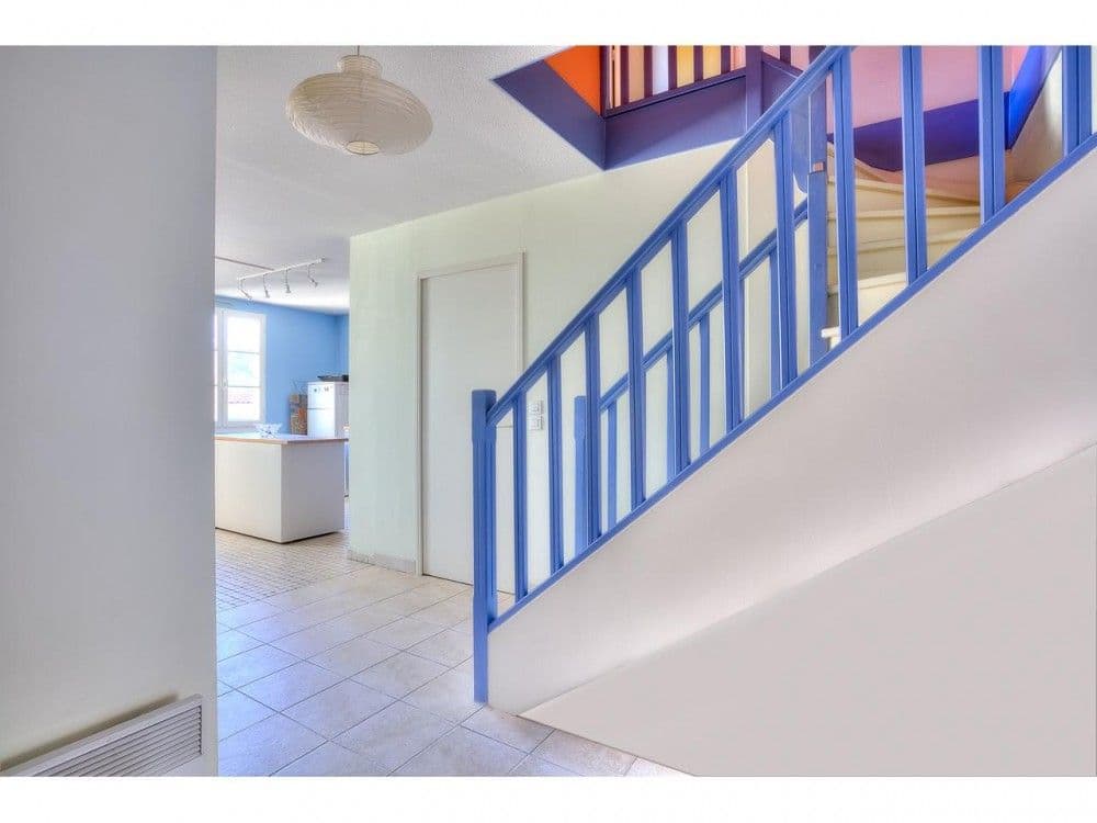 Staircase with blue banister to the upper floor, 2-bedroom apartment in the Old Town, Nice