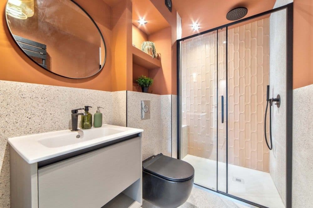 Shower room with terracotta walls, terrazzo and walk-in shower, 2-bedroom apartment in the Carré d’Or, Nice