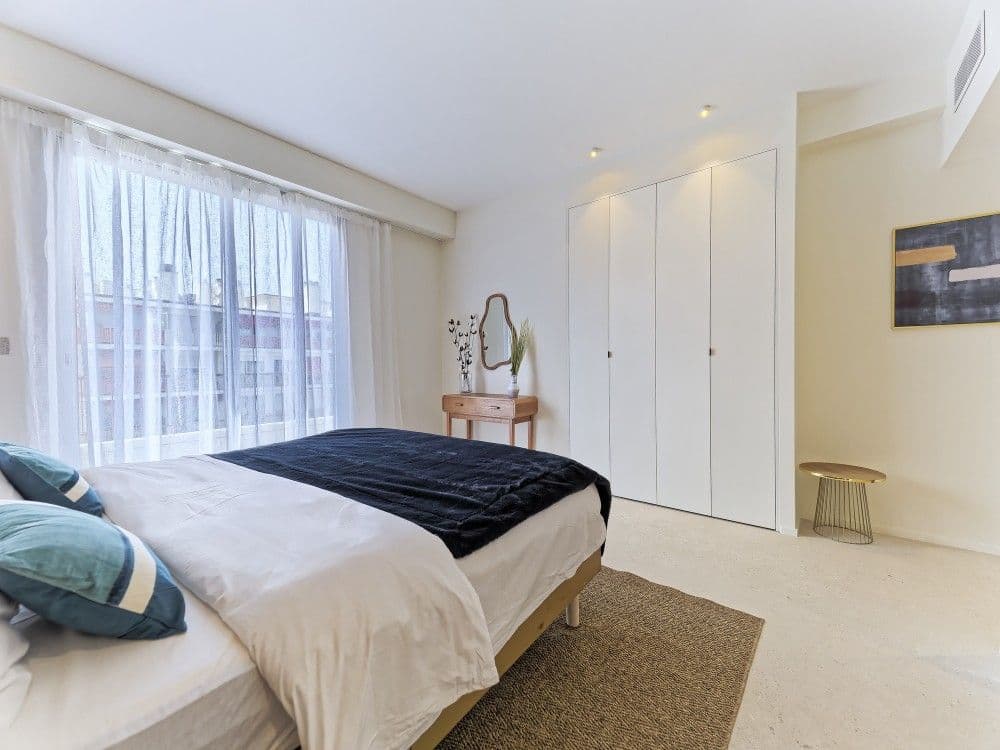 Bedroom with fitted wardrobes and sheer curtains, 2-bedroom apartment in the Promenade des Anglais, Nice