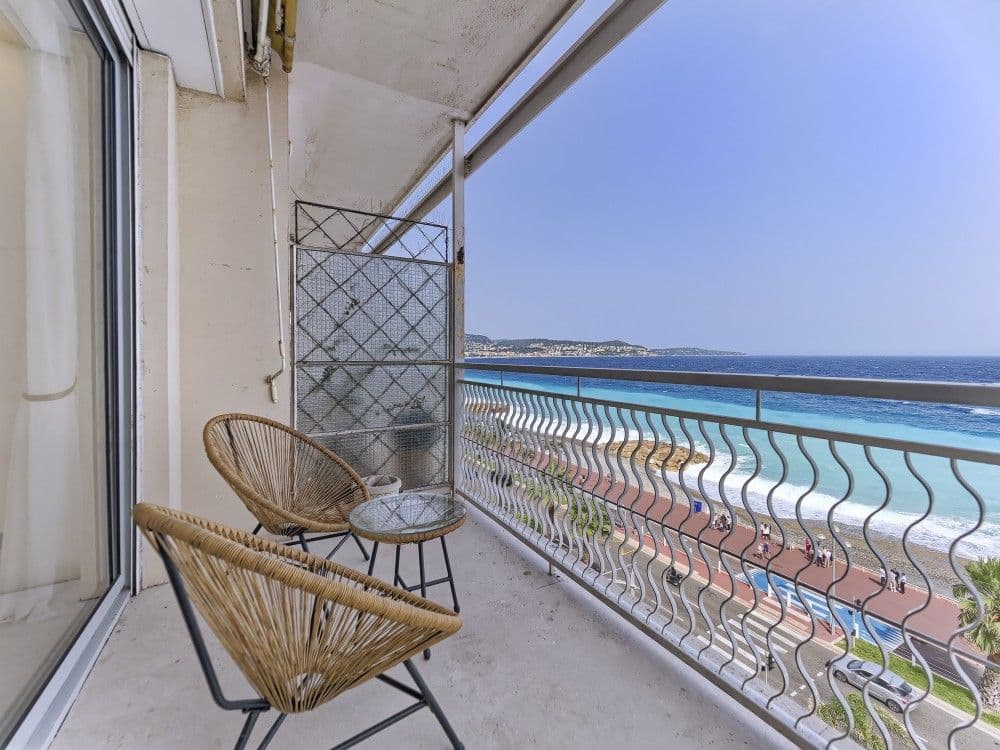 Balcony with rattan chairs facing the sea and the Promenade des Anglais, 2-bedroom apartment in the Promenade des Anglais, Nice