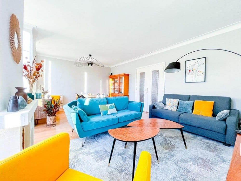 Living room with two sofas and wooden floor, 2-bedroom apartment in central Nice