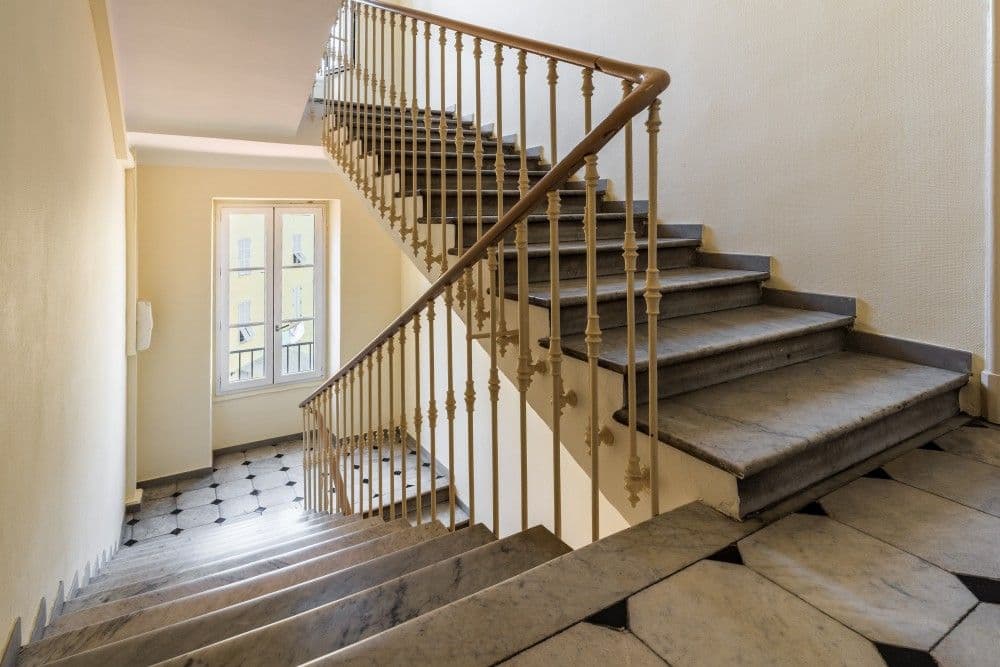 Stone staircase with wrought-iron banister, 2-bedroom apartment in the Port, Nice