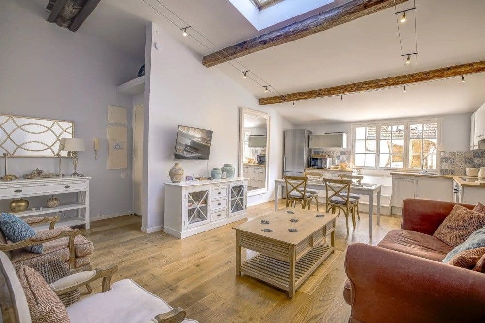 Living room with exposed beams, skylight and open kitchen, 2-bedroom apartment in the Old Town, Nice