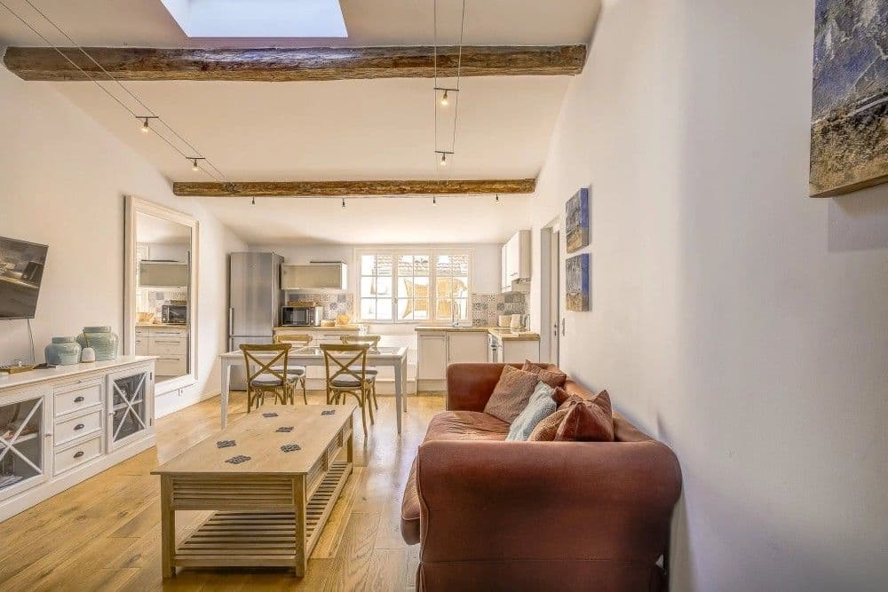 Living room with exposed beams and skylight, 2-bedroom apartment in the Old Town, Nice