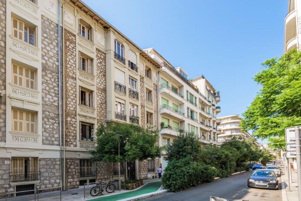 Tree-lined street with stone and render façades, 1-bedroom apartment in central Nice