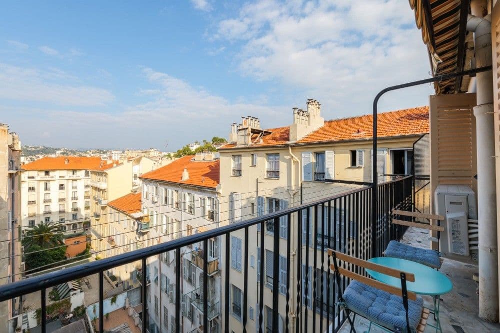 Balcony with bistro set and a view over the rooftops, 2-bedroom apartment in central Nice