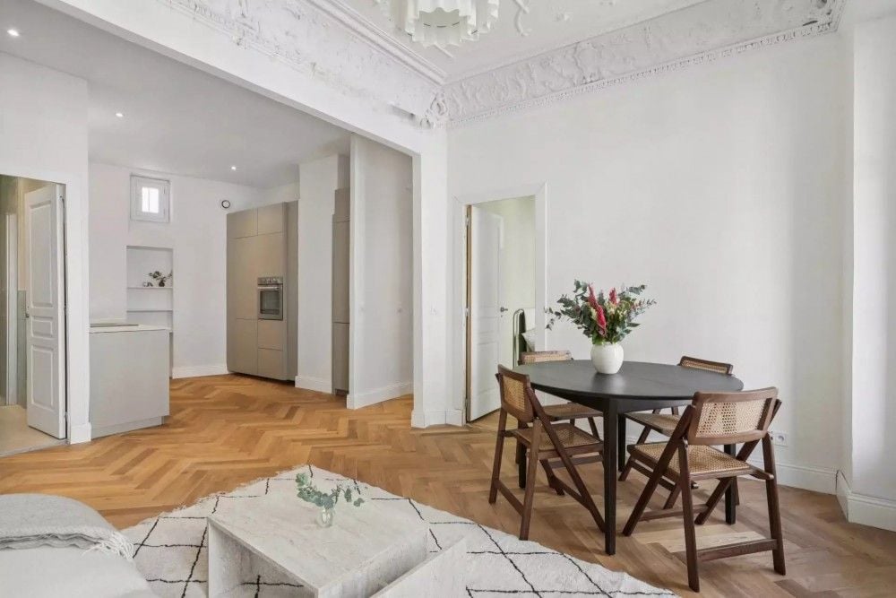 Living room with dining table and kitchen beyond, 2-bedroom apartment in central Nice