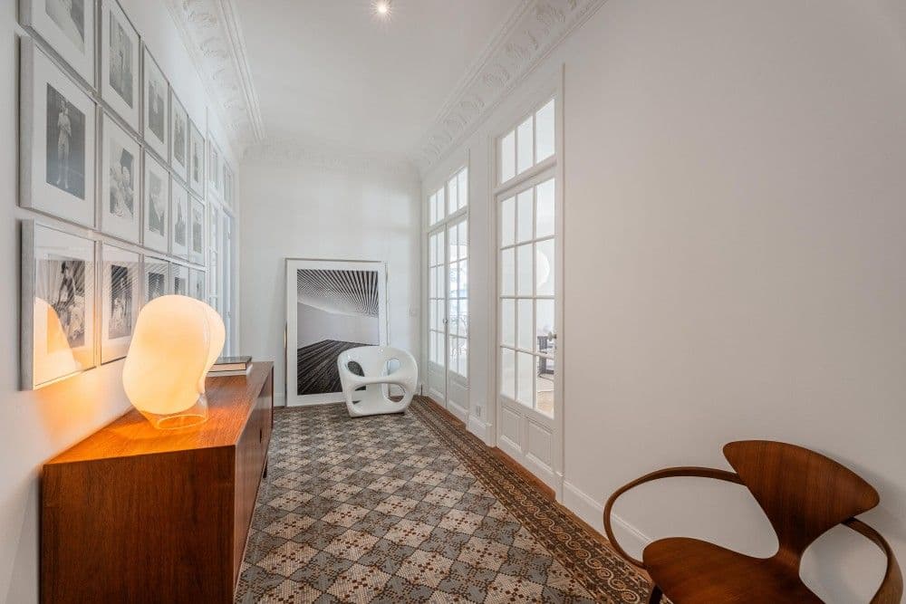 Gallery hallway with framed photographs and cement tiles, 3-bedroom apartment in the Promenade des Anglais, Nice