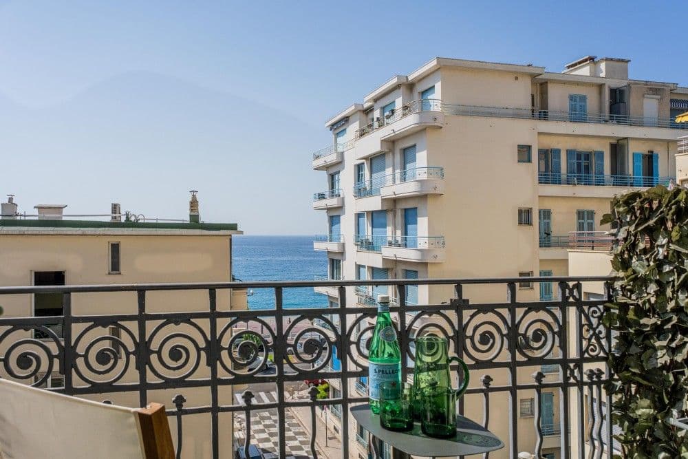 Balcony with a view between buildings to the sea, 3-bedroom apartment in the Promenade des Anglais, Nice