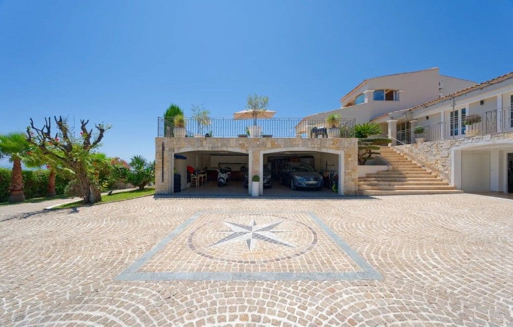 Paved courtyard with compass-rose mosaic and garages below the villa, 3-bedroom villa in Fabron, Nice