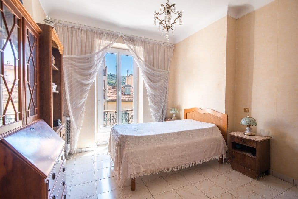 Bedroom with French window and chandelier, 2-bedroom apartment in the Port, Nice