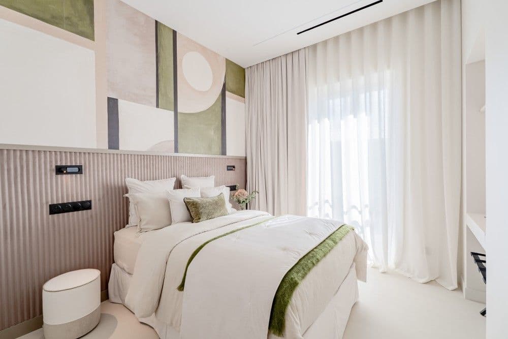 Bedroom with green and blush mural and sheer curtains, 3-bedroom apartment in Wilson, Nice