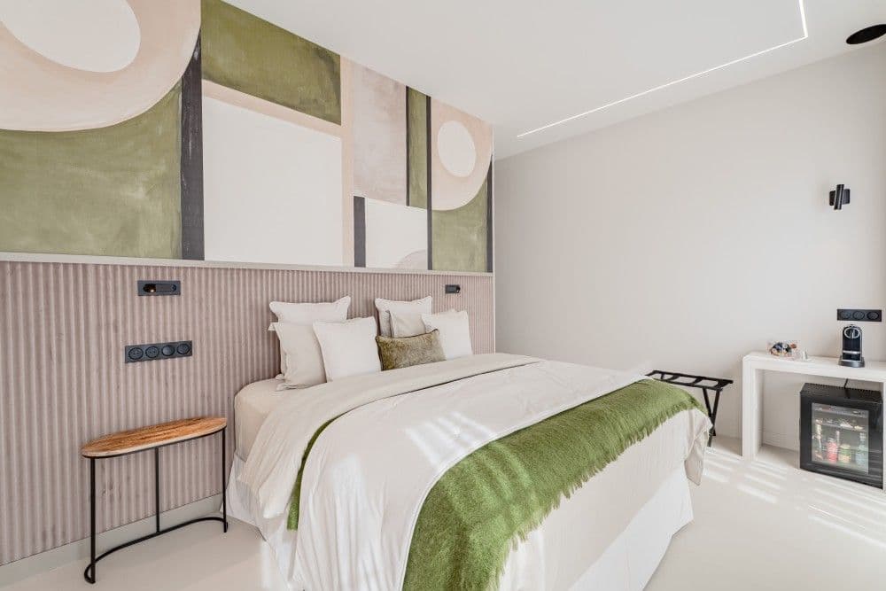 Bedroom with green mural and velvet throw, 3-bedroom apartment in Wilson, Nice