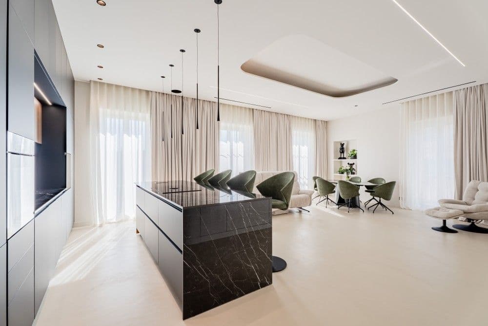 Kitchen with black marble island and pendant lights, 3-bedroom apartment in Wilson, Nice