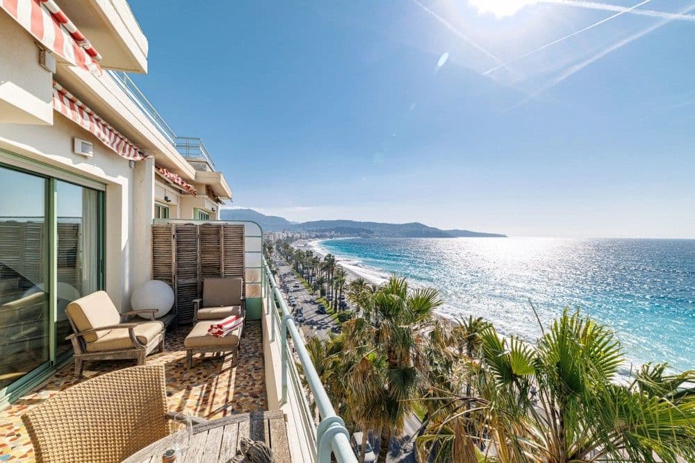 Terrace with seating above the palm-lined Promenade, 3-bedroom apartment in the Promenade des Anglais, Nice