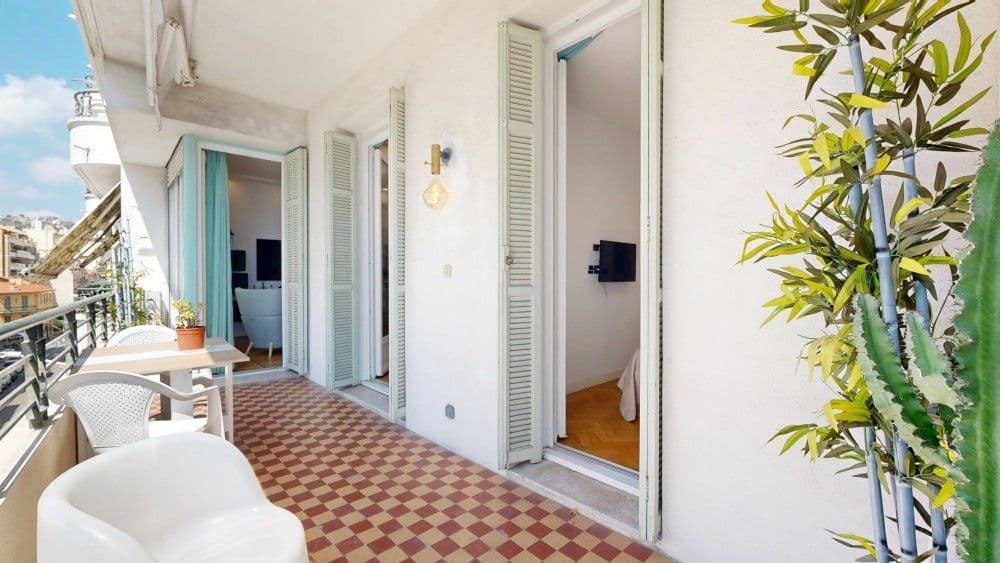 Balcony with armchairs along the apartment, 1-bedroom apartment in the Promenade des Anglais, Nice